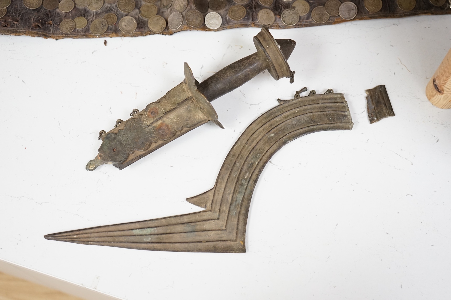 A 19th century Persian silver, niello work and coin mounted belt, dated 1880 (1297 AH in script) and an African sword (broken)